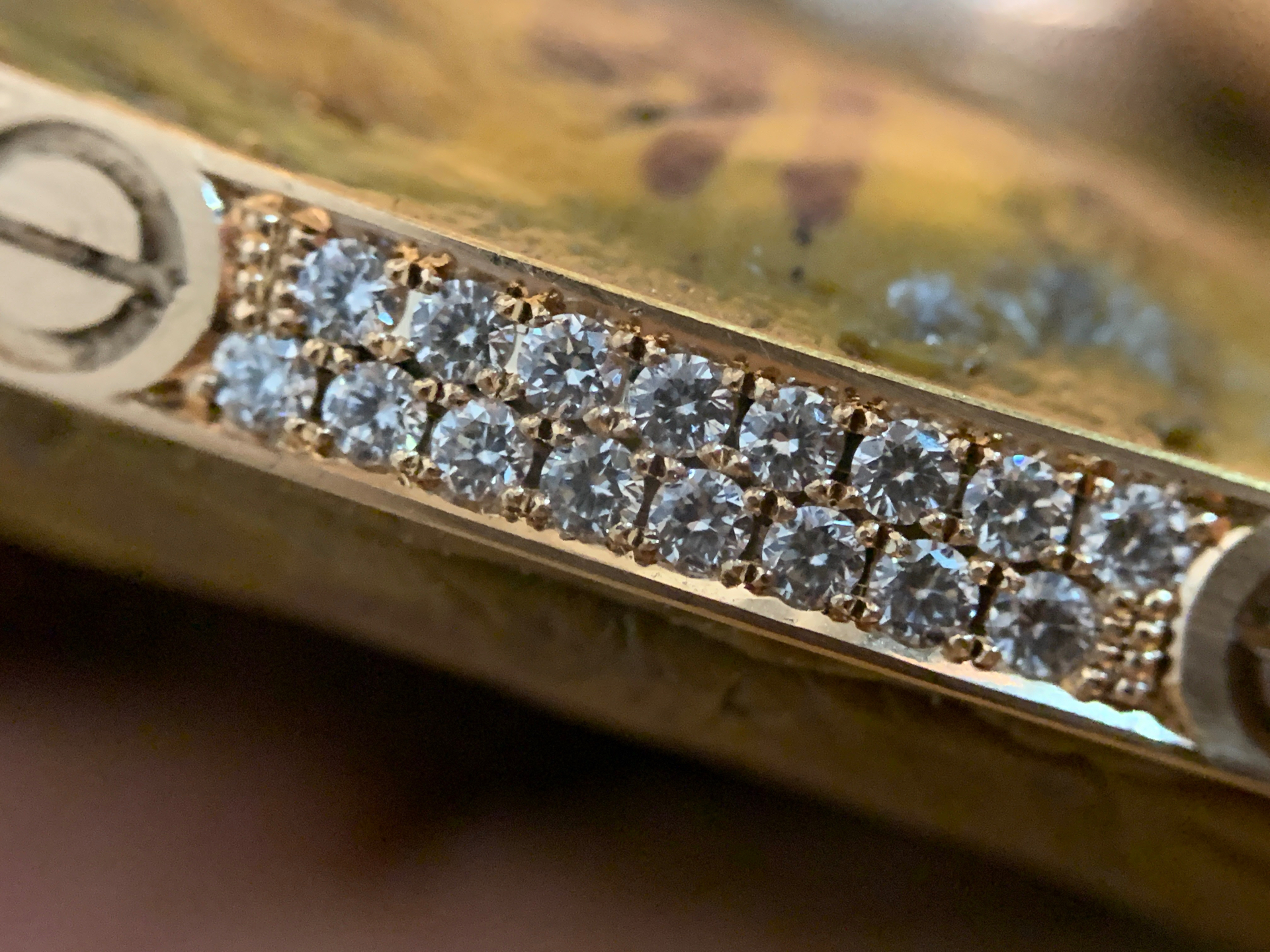 Close-up of a micro diamond setting in progress at the bench